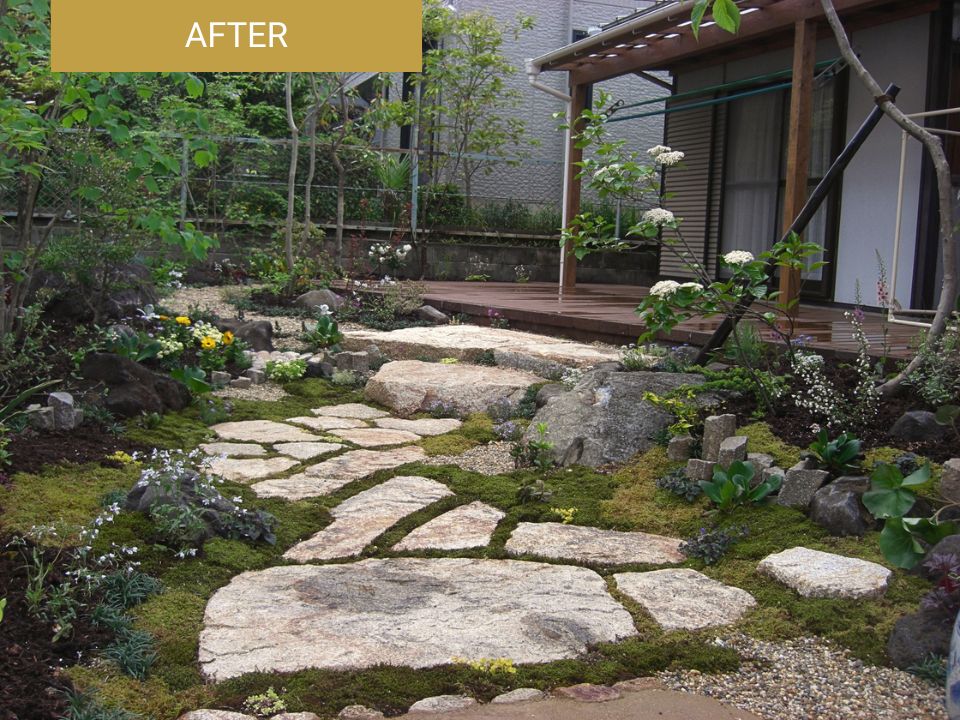 石の園路や植栽を取り入れてつくり直した施工後の庭の写真